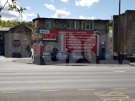 Advertising hoardings on gable walls, Lockwood Road, Huddersfield, United Kingdom
